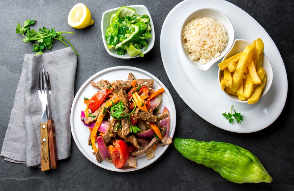 Peruvian dish Lomo saltado - beef tenderloin with vegetables